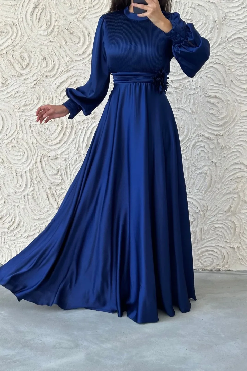 Satin modest dress with puff sleeves and floral waist detail.