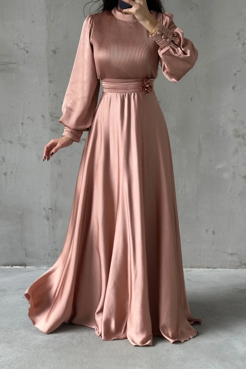 Satin modest dress with puff sleeves and floral waist detail.